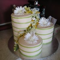 3 Tower Wedding Cake I made this for my friends wedding. It is a key lime pie poundcake covered in fondant icing with silk flowers.