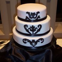 Black And White Anniversary 3 tiered (14. 10. 8) 3 flavored cake, fondant covered. Hand painted design. Painted with gel colour "watered down" with vodka. I...