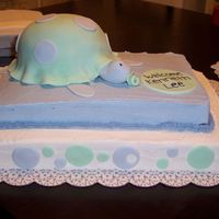 Turtle Baby Shower Cake This is my 1st paid cake! 2 tier sheet cake. Butter cake with buttercream frosting. Turtle is covered in fondant. Fondant decoration on...