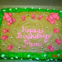 Pigs In The Mud Made this for a pig lover! All buttercream piggies laying in the mud with flies buzzing around. I used a Wilton tip # 67 to make grass...