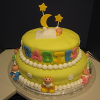 Baby Shower For Eight! I made this cake for a work party celebrating 8 new moms! babies are made from fondant, and the cake is covered with rolled fondant.