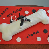 Dog And Bone This is a red velvet cake made in a jelly roll style filled with cream cheese icing and covered in fondant. The doggie is fondant/gumpaste...