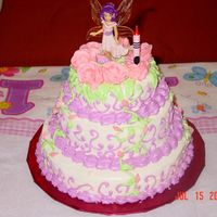 1St Birthday Fairy Garden Cake This is my first trial at stacked cakes! I wanted something special for my daughter's 1st b'day. I see a lot of flaws in the cake...