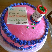 Pharmacist Cake Iced in buttercream with fondant accents.