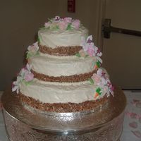 First Wedding Cake I made this Carrot Cake for my inlaws wedding i made the roses and leaves and orderd the lilies