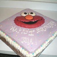 Elmo Cake This is third cake that I've ever decorated...for a friend's daughter's first birthday. Elmo is all chocolate with...