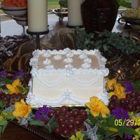 Bridal Shower Cake This is a white/almond 8" cake with BC icing. I wasn't very happy with my swags and flowers but after they put all of the...