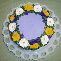 Spring Flowers Top view of a cake I made for my women's Bible study potluck. Wanted to try a purple cake - so I made royal icing pansies, violets,...