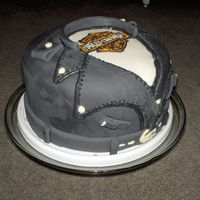 Harley Leather Jackey I owe the design to this to Pyxxydust, she gave me great instructions. Its all fondant with buttercream. Thanks for looking!