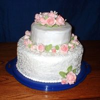 Wilton Course 3 Grad Cake I rolled the fondant a little thin. Especially for a chocolate cake, but I really like how my fondant roses and babysbreath turned out. I...