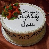 Berrykiwi Birthday vanilla cake with kiwi and strawberries in the filling. WCBC and ruit on top.