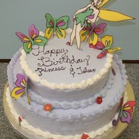 Tinkerbell Tiered Cake Liquid chocolate Tinkerbell and butterflies. White chocolate buttercream (WCBC), chocolate cake with chocolate filling, vanilla cake with...
