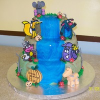 Dora Holloween chocolate and vanilla cakes covered in MMF. Dora was a candle that the customer was going to put on top. The Dora characters were hand...