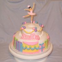 Baby Girl's 1St Birthday Cake Pound cake with vanilla icing. Fondant decorations, gumpaste/fondant lettering that's powdered with luster dust. I even dusted the...
