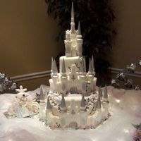 Castle Wedding Castle wedding cake in fondant. Castle is sugar mold. The carriage is also a sugar mold, Prince and Princess are Disney characters.