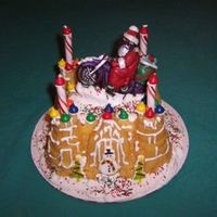 Santa On Bike Castle bundt cake mold. Chocolate santa mold with dustings. Royal icing snow, purchased candies.