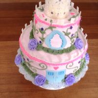 Castle Cake This was made for a client's 6 year old daughter's birthday. Mostly buttercream. Tiara is gumpaste. Windows and door are fondant...