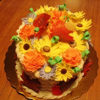 Basket Of Flowers Small oval cake, buttercream basketweave, gumpaste flowers