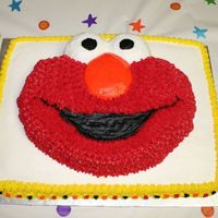 Elmo Birthday Cake TIme ran out on making two seperate cakes so I stacked them to keep the same # of servings. Thought it made Elmo stand out more too!!