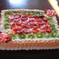 Pastel De Tres Leches !/4 sheet of pastel de tres leches decorated with fresh strawberries and kiwi.Yummm