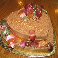 50Th Anniversary Cake This cake is a German Chocolate cake with Chocolate buttercream frosting. The leaves and bands around the bottom of the cakes are made from...