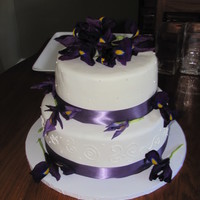 Wedding Iris Cake My first wedding cake ever.. Chocolate Mudd with chocolate and vanilla buttercreme fillings.. Covered in MMF and real iris's and...