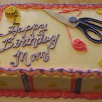 Sewing Cake This was a 9x13 white cake on bottom, buttercream filling, chocolate on top, covered in buttercream and my very first attempt using MMF. I...