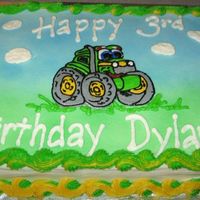 John Deere Cake John Deere cake with buttercream frosting. I used the Wilton spray to airbrush--I am too cheap to buy the airbrush system.