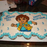 Diego Cupcake Cake This was done for my nephew's 3rd birthday. Yellow cupcakes with buttercream icing. Diego was done by a frozen buttercream transfer.