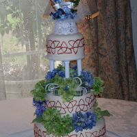 Wedding_Cake.jpg My first wedding cake, the knot is painted with copper lusterdust. I had a pretty good time doing this cake but see much need for...