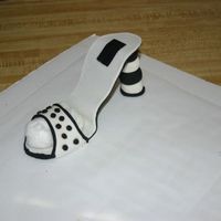 Img_5479.jpg This is my first attempt at making a shoe out of gumpaste and fondant. So far like the way it looks. I still have to make the matching cake...