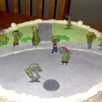 Ed, Edd N Eddy This was a marble cake with whipped chocolate ganache filling. Cake was frosted in buttercream. The cul-de-sac was made with MMF, and the...