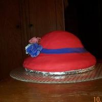 Red Hat Society This was my first hat cake. Alot of fun to do! I used the vannila carmel creamer for the cake. It's covered in fondant and the roses...
