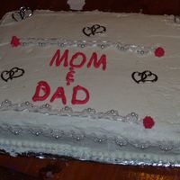 Parents Anniversary Cake This is a French Vanilla cake with buttercream icing..hearts and lace I bought at Walmart . Im just starting out and have had no classes so...