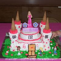 Birthday Castle I made this for my daugters birthday she wanted Barbie and Bratz on it..The bottom is white sour cream cake filled w/ bc the top is choc.....