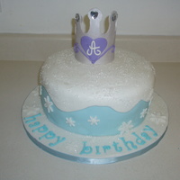 Winterwonderland Princess Cake Cake coveed in fondant. I used crystal sugar and sprinkled on top, snowflake cutouts, and gumpaste crown add to the finishing touches....