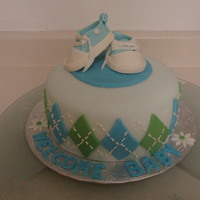Baby Converse Baby Shower Cake Shoes made from fondant. Cake is WASC with vanilla BC icing covered in fondant