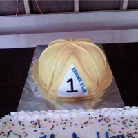 Firefighters Helmet This was a cake that I made for my grandpa. He wanted to thank the fire department that he has been a part of for many years. He unable to...