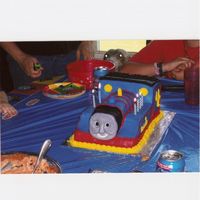 Thomas The Tank Engine I made this Thomas the Tank Engine cake for my two sons birthday. It was a chocolate cake carved from rectangles. It was covered in a light...