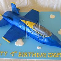 Blue Angel Airplane Blue angel scultpted from loaf cakes. Covered in fondant. Wings are cardboard covered in fondant. Thanks to Doug for his help.