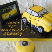 Yellow Mini Cooper Mini cooper cake carved from 3-D cruiser...also made a small logo cake to feed the number of guests.