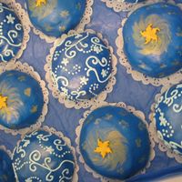 Constellation And Sun Cakes Chocolate mini cakes with choc. buttercream...covered with MMF and decorated with luster dust and royal icing and fondant stars.