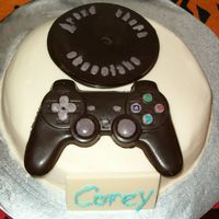 Cake_009.jpg I made this for my brother's birthday. He loves video games. The cake is a butter cake with buttercream dream icing. The controller,...
