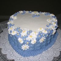 Flower Basket 8" white cake with raspberry filling, BC icing, RI flowers. It's one of the cakes from a Wilton book that I wanted to make. The...