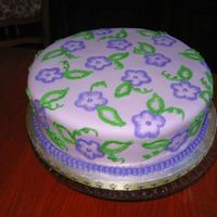 I_Like_Purple.jpg Nati's chocolate cake with whipped white chocolate ganache filling and MMF. I was just practicing brush embroidery.