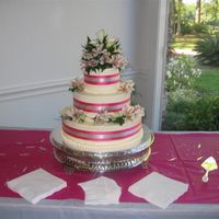 My First Wedding Cake Yellow cake with vanilla SMBC icing. 14"-10"-6" rounds. I used an acetate ribbon under the ribbonsto keep the cake safe from...
