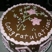 Baby Shower Fraga Strawberry cake w/chocolate buttercream icing. Pink, green, white decorations. Flowers on top match pattern on bedding in the Nursery. Pink...