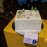 Snow Family Dummy cake frosted with royal icing. All deorations made of fondant for local county fair.