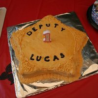 Grandson's Smash Cake Daughter is a Deputy Sheriff. His theme was cowboys so had to make him a "Badge" Thanks for looking