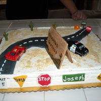 Joey's 1St Birthday Cars Theme Chocolate with butter cream. Everhting but the 2 cars is fondant